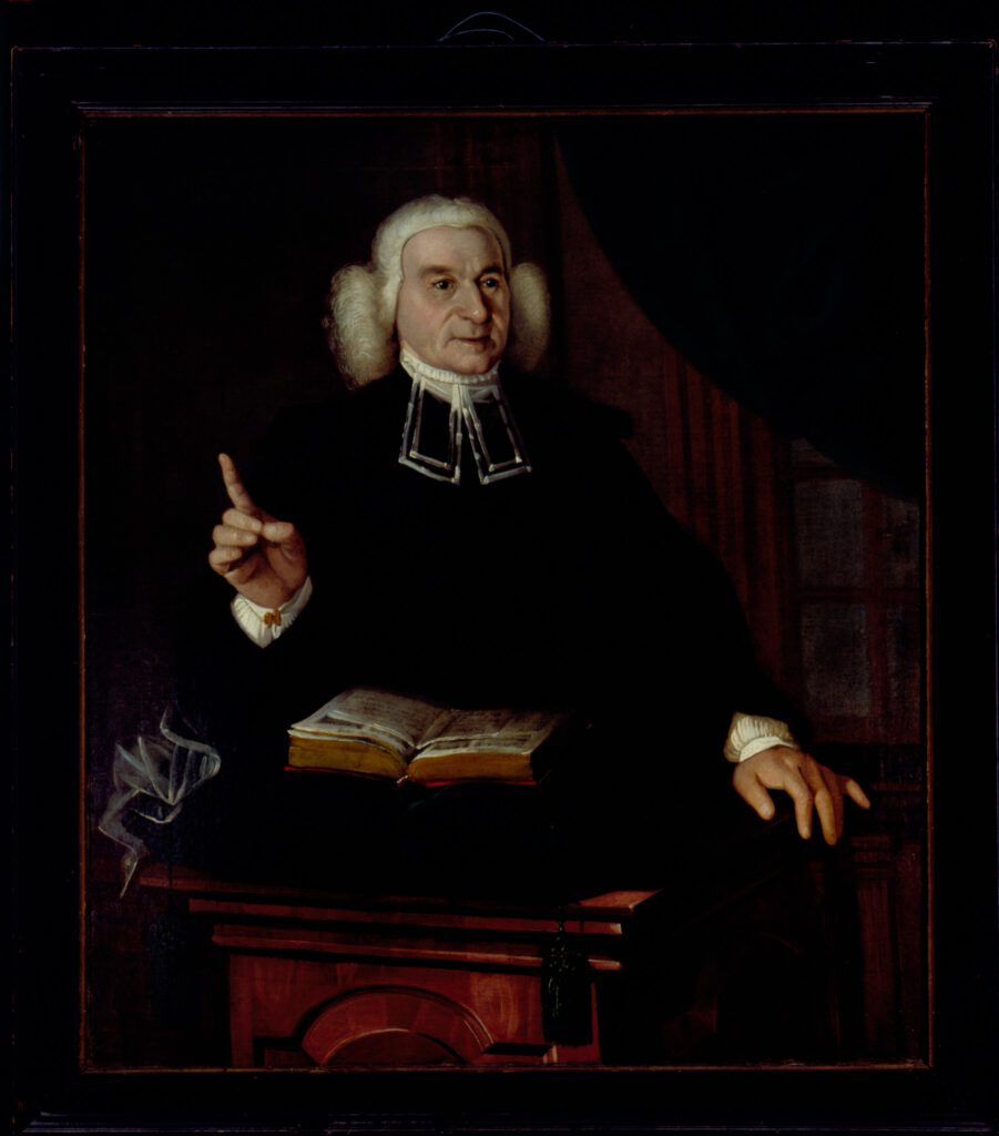 A portrait of an intimidating-looking minister with one finger and hand raised. The man wears a powdered wig and sits against a dark background.