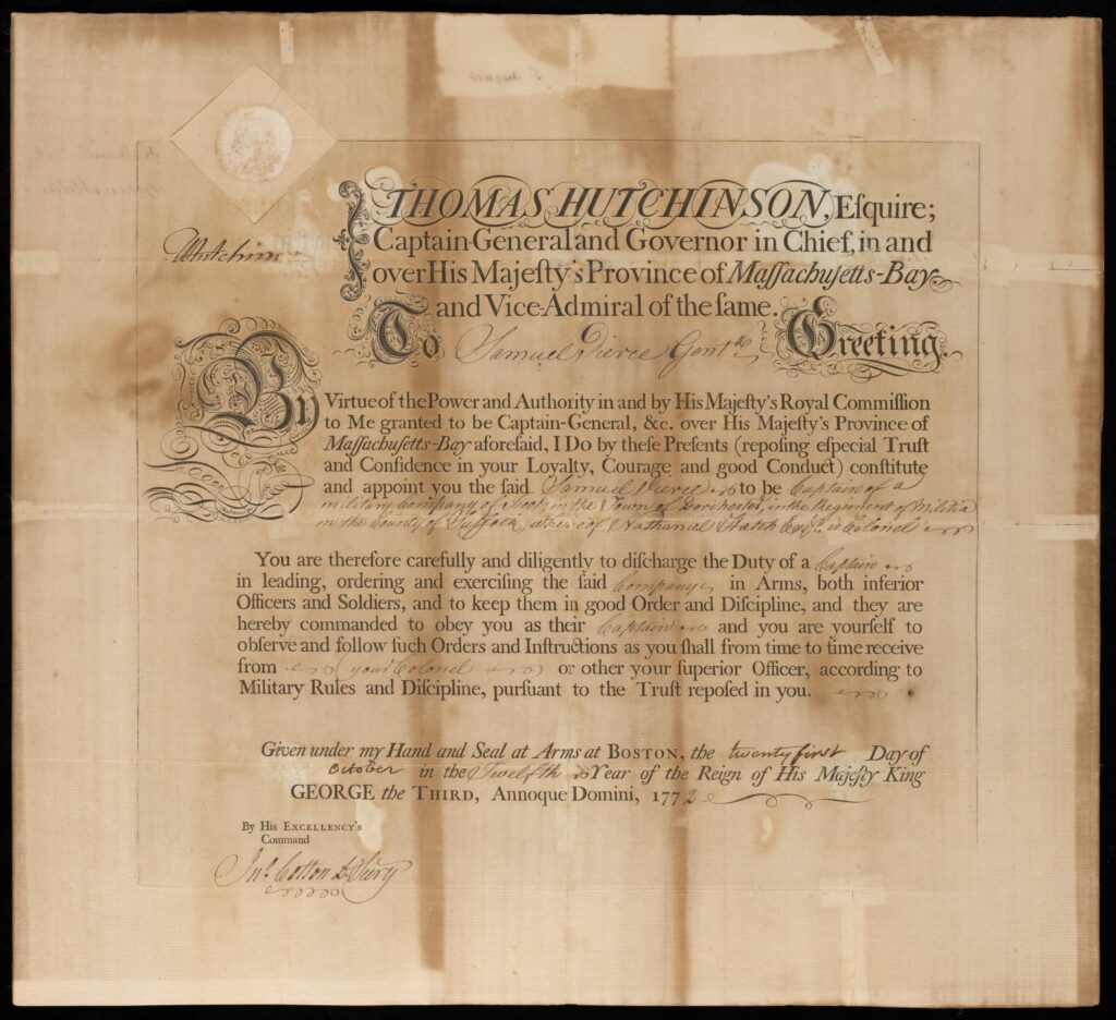 An ornate document with cursive script detailing the commission of Pierce by the governor. Some of the text is printed in a template, while details are filled in with ink. The page is visibly damaged by folding over the years, with two vertical creases.